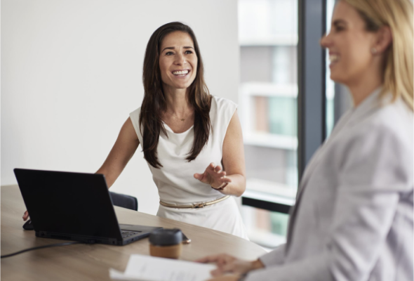 Happy employees chatting in an office