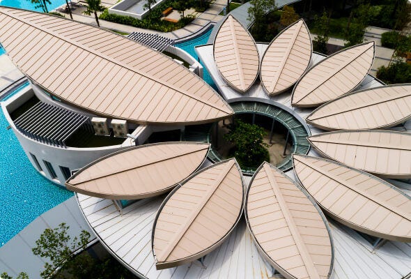 Ariel photograph of a modern building with a segmented roof